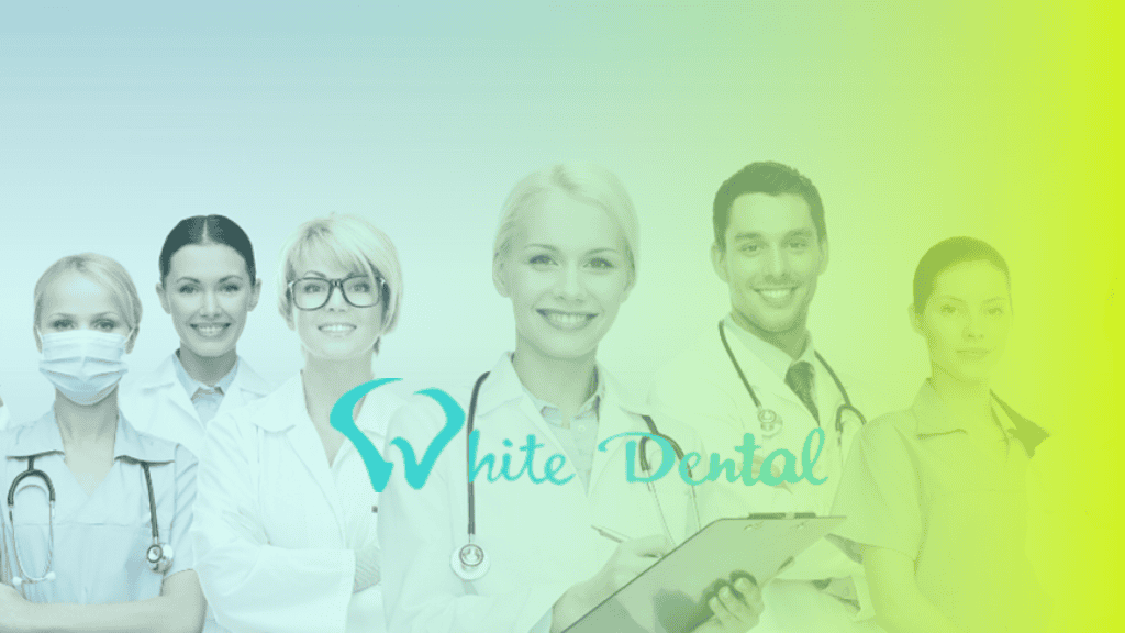 Five dental professionals stand in a row, some smiling in white coats and medical attire. The words White Dental and a tooth logo are displayed, highlighting their commitment to corporates wellness.