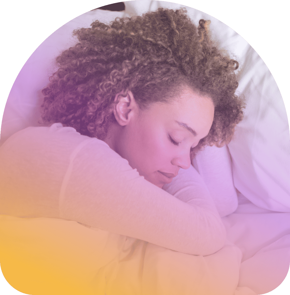 A woman with curly hair sleeps on her side in bed, resting her head on a pillow with a calm expression. The image, featuring a purple and yellow gradient overlay, highlights the restful support of Coya for first responders.