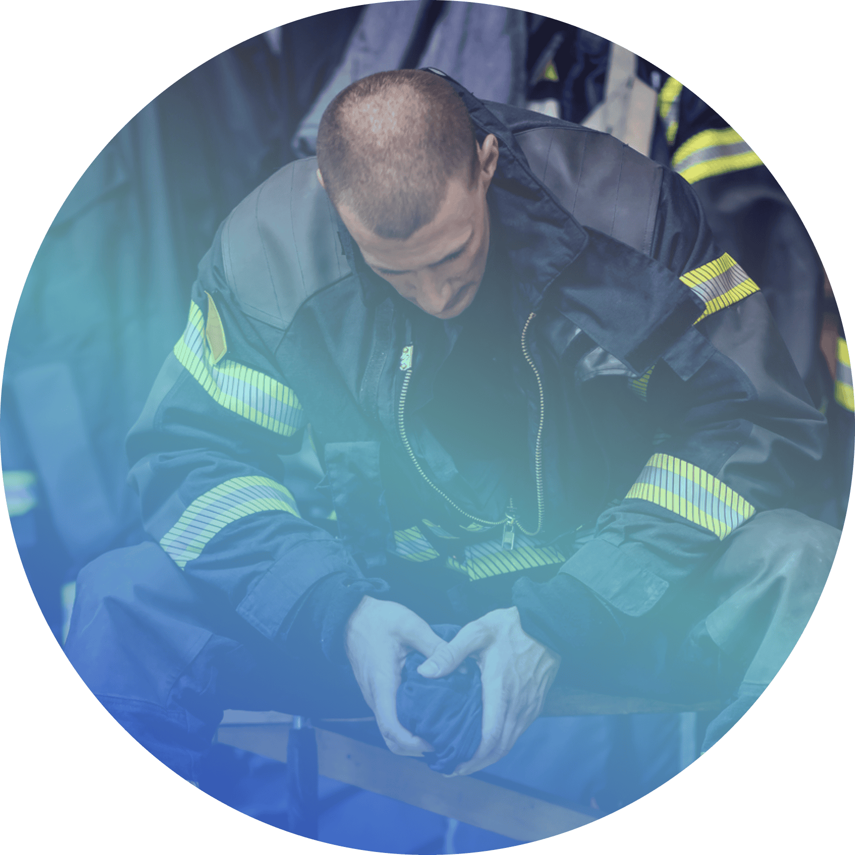A firefighter in uniform sits with his head bowed and hands clasped, appearing tired or deep in thought—perhaps reflecting on the demands faced by first responders and the support offered through programs like Coya for first responders.