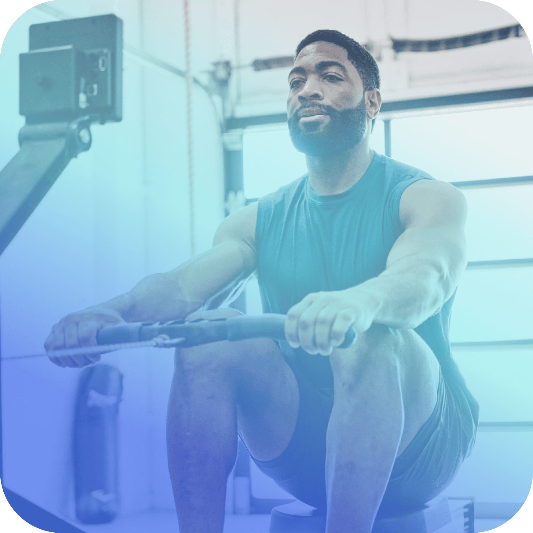 A man wearing a sleeveless shirt exercises on a rowing machine in a gym setting, showcasing how coya for fitness clubs supports an active lifestyle.
