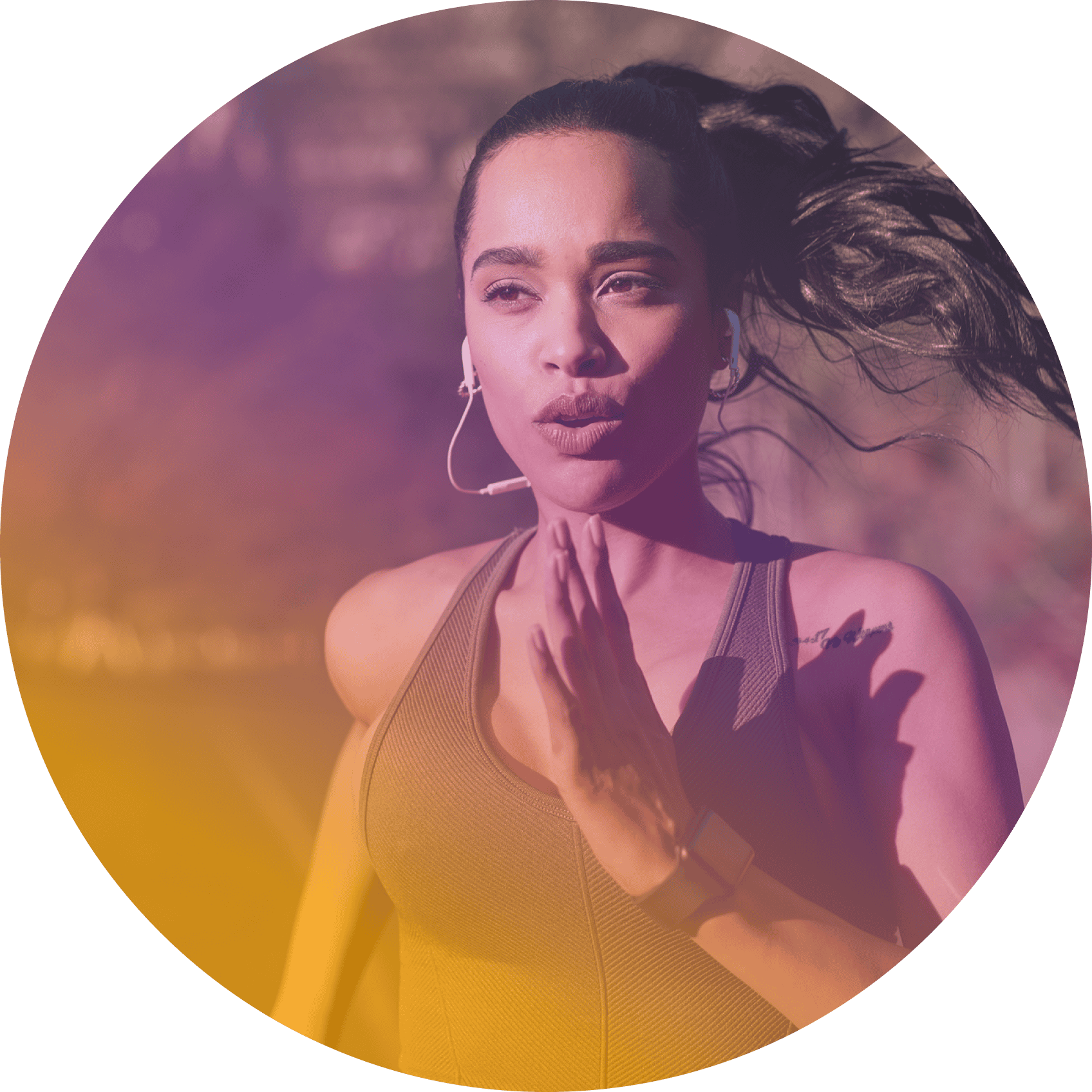 Woman running outdoors, wearing wireless earphones and athletic clothing with her hair in a ponytail. The image features a circular crop and a purple-orange overlay, perfect for promoting coya for student athletes seeking an active lifestyle.