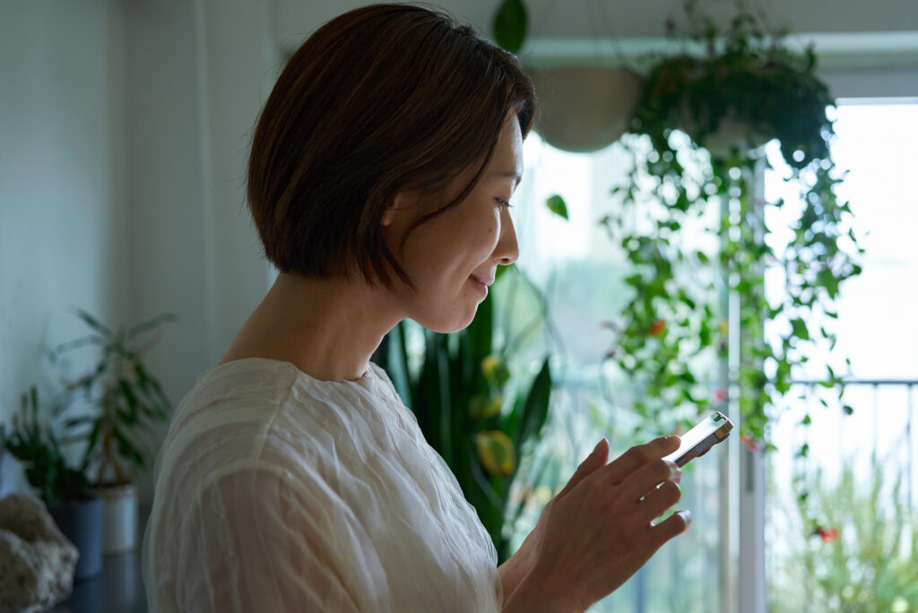 A woman operating a smartphone