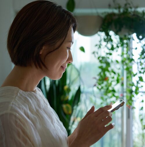 A woman operating a smartphone