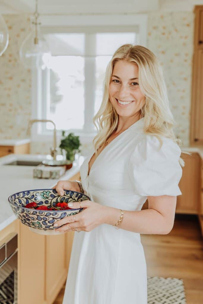 Liz bouma holding a bowl of fruit