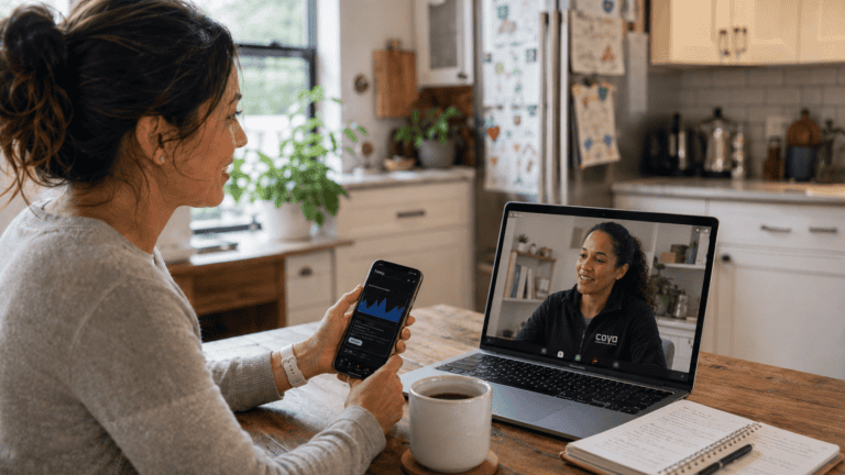 Woman engaging in a virtual mental health session via laptop and smartphone at home.